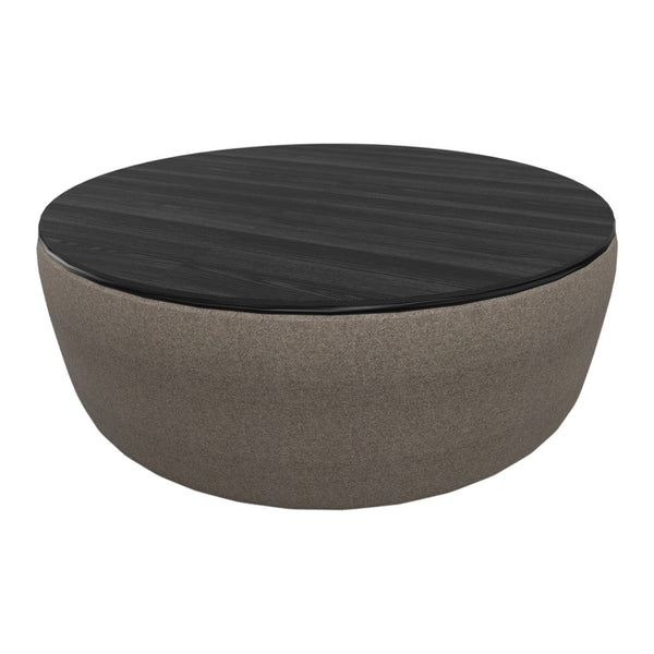 Round coffee table featuring a dark wood top and a soft, beige fabric base for a modern look.