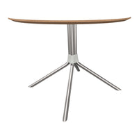 Modern round tabletop in light wood finish with sleek silver metal legs for a contemporary look.