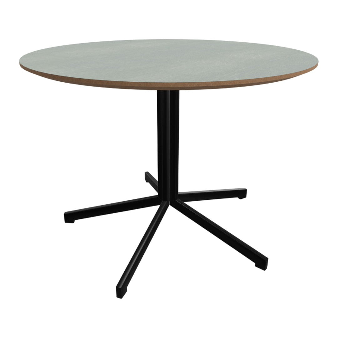 Round dining table with a soft gray top and a contrasting black metal base, featuring a modern minimalist design.