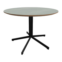 Round dining table with a soft gray top and a contrasting black metal base, featuring a modern minimalist design.
