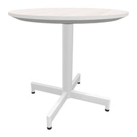 Round white dining table with a light wood top and minimalist design, featuring a sturdy white cross base.