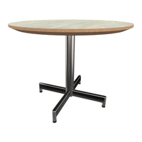 Round wooden tabletop with a natural wood finish, supported by a sleek black metal base. Modern design, neutral colors.