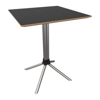 Black square tabletop with light wood edges, supported by a sleek silver metal base, stylish and modern design.