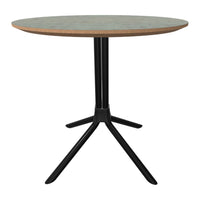 Round table with a greenish top and contrasting black base; minimalistic design with natural wood accents.