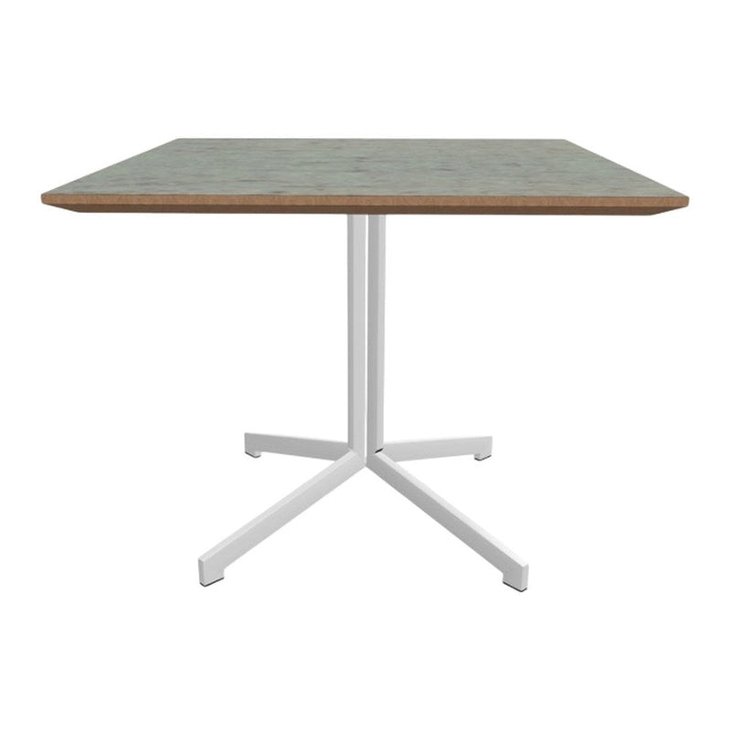 Square dining table with a light green patterned top and white metal legs, perfect for modern decor.