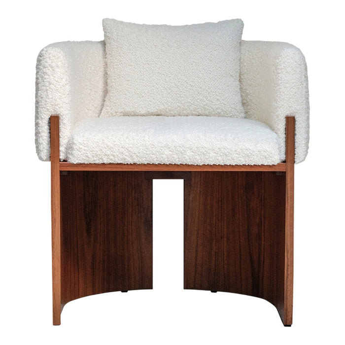 White boucle fabric armchair with a wooden frame and matching cushion, creating a cozy, modern aesthetic.