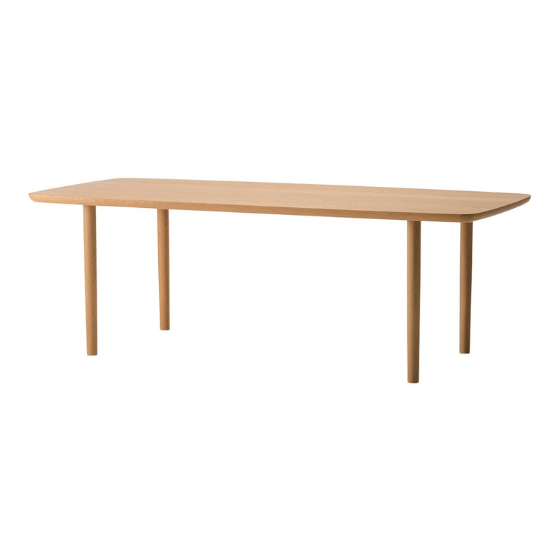 Light wood dining table with a smooth, natural finish and a minimalist design, featuring rounded edges and sturdy legs.