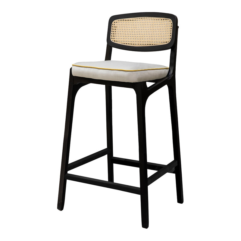 Black bar stool with a natural cane backrest and white cushion featuring a subtle gold trim. Elegant and modern design.