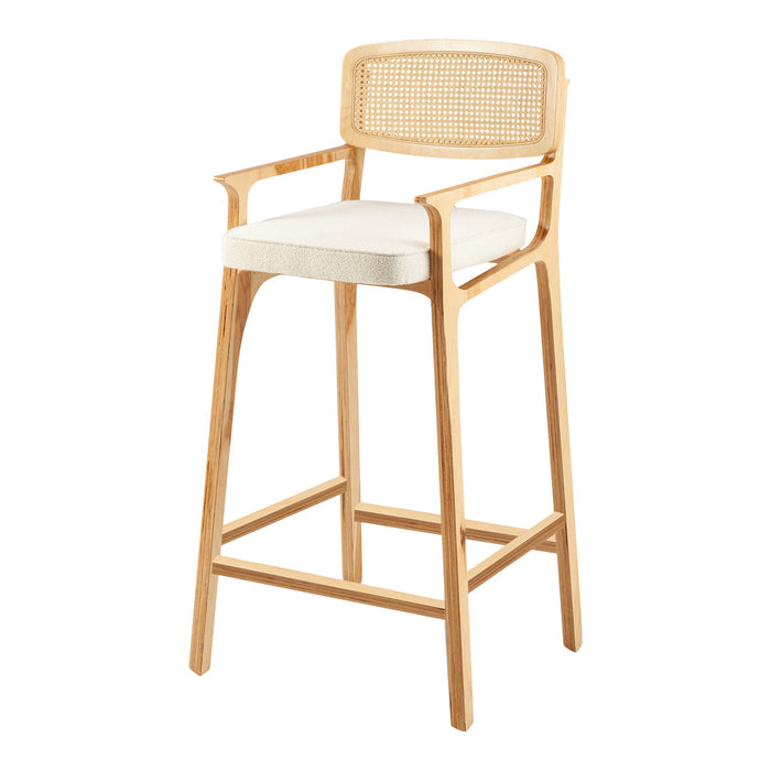 Light wood barstool with natural cane back, featuring a plush cream cushion for comfort and style.
