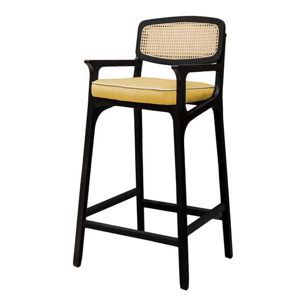 Black bar stool with a yellow cushioned seat and a natural cane backrest, featuring clean and modern lines.