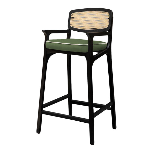 Black wooden bar stool with a green cushion and woven cane backrest, adding a touch of modern elegance.