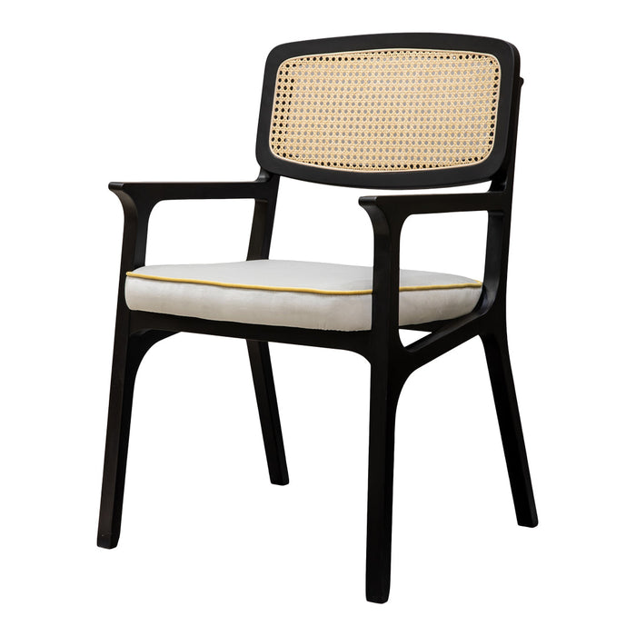 Black wooden chair with a rattan backrest and a white cushion accented with yellow trim. Elegant and modern design.