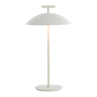 Modern white table lamp with a sleek dome shade and slim base, featuring a minimalist design and smooth finish.