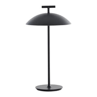 Sleek black metal table lamp with a dome shade and minimalist design, perfect for modern decor.
