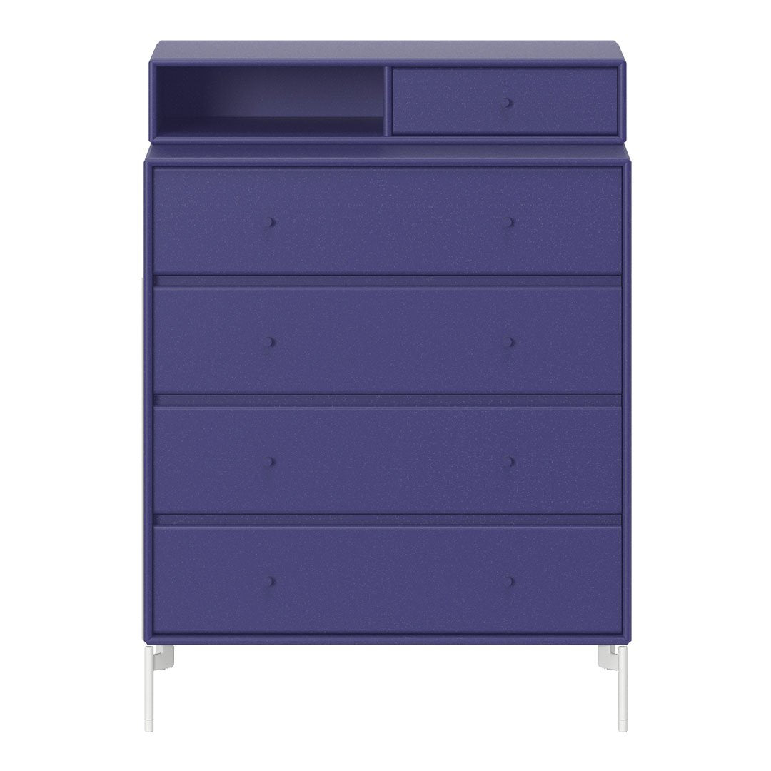 Vibrant purple dresser with four textured drawers and a minimalist design, featuring a contrasting white base.