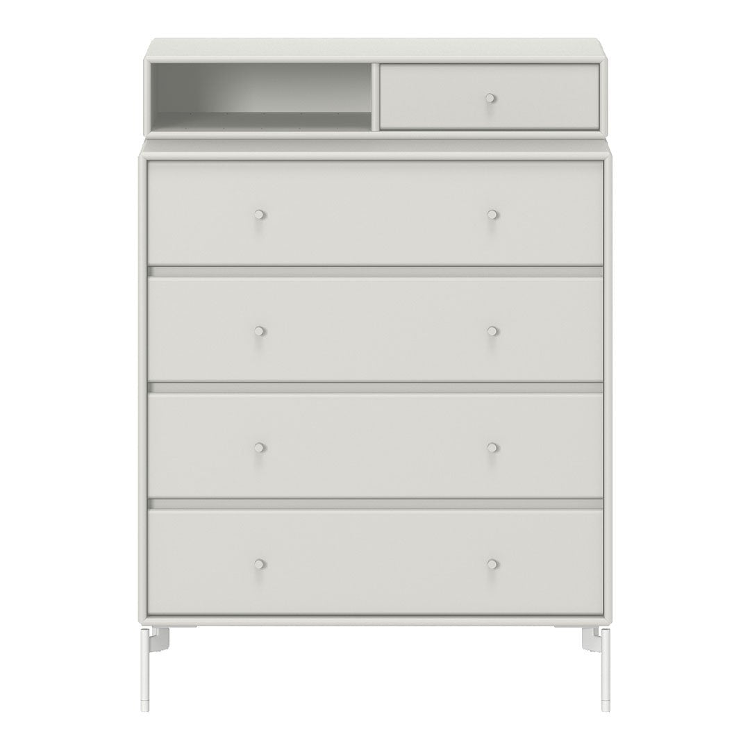 Light gray dresser with smooth finish, featuring modern minimalistic design and sleek drawer knobs.