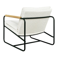 Cream-colored chair with a textured surface, featuring a sleek black metal frame and natural wood accents.