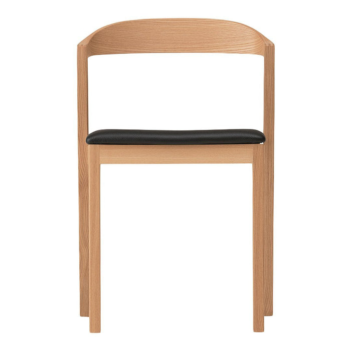Natural wood chair with a minimalist design featuring a light wood frame and a sleek black seat. Perfect for modern decor.