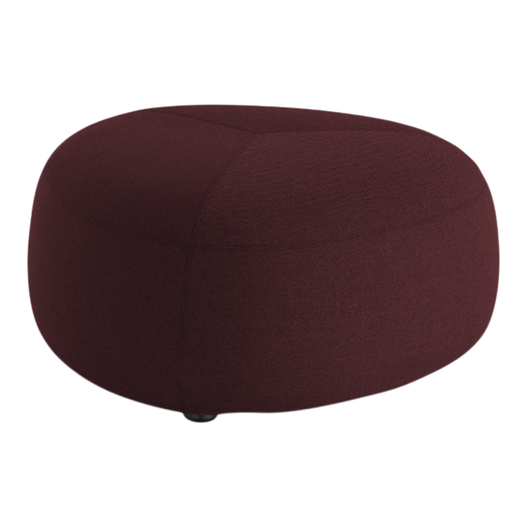 Burgundy round pouf with a smooth, solid texture, perfect for adding a pop of color to any space.