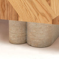 Natural wood grain with light oak tones and contrasting textured concrete legs in a modern design.