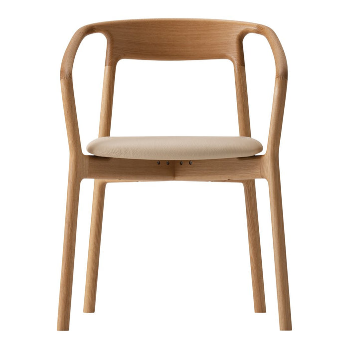 Light wood armchair with a beige cushioned seat, featuring smooth, minimalist lines and a natural finish.