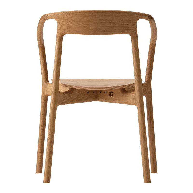 Natural wood chair in warm honey tones with a smooth, minimalist design and uniform finish. Perfect for modern spaces.