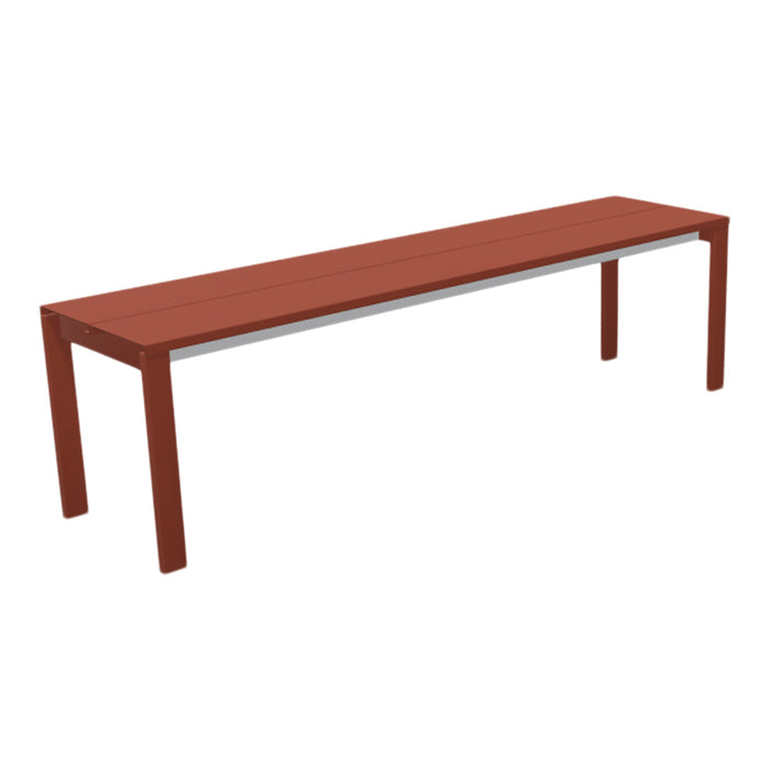 Modern bench in rich terracotta color with sleek, minimalist design and smooth, solid surface. Ideal for outdoor spaces.