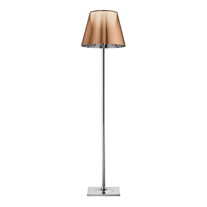 Elegant floor lamp featuring a sleek chrome base and a warm amber fabric shade. Modern design with a stylish sheen.