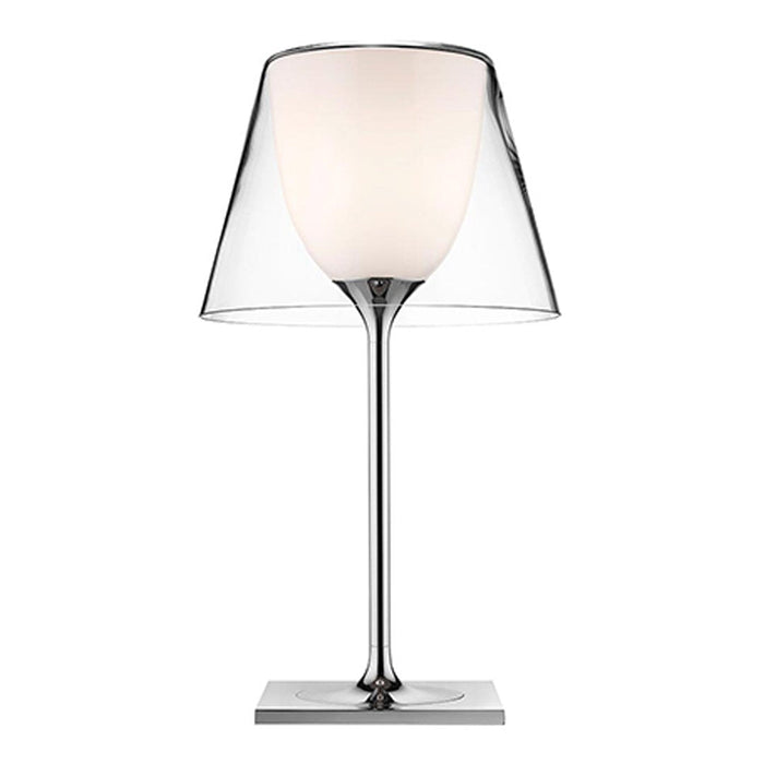 Clear glass lampshade with white inner, sleek chrome base, modern design, perfect for stylish decor.