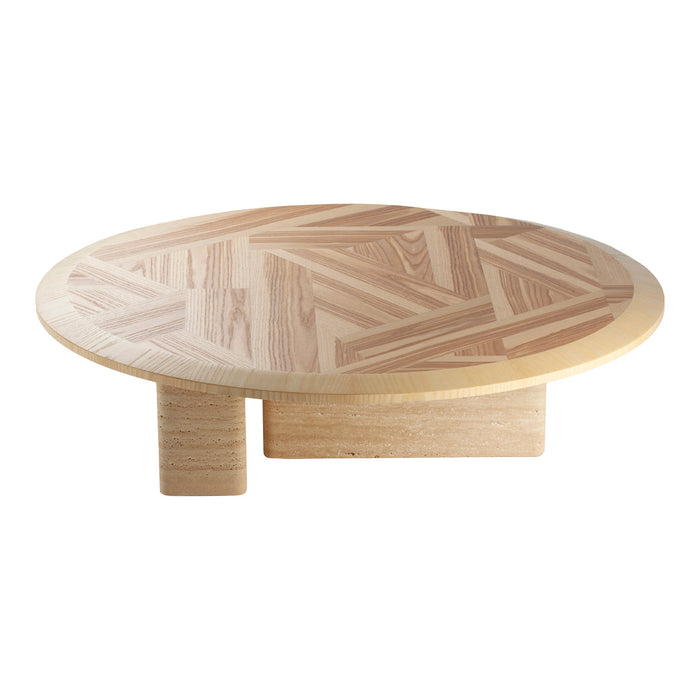 Round wooden table with a light wood finish and herringbone pattern on the top. Modern, minimalist design.
