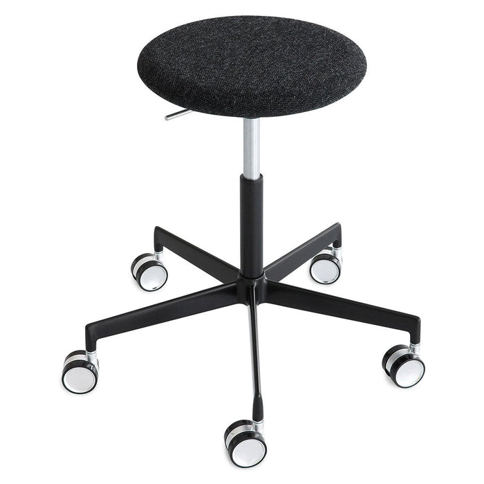 Black adjustable stool with a round fabric seat and a sleek metal base, featuring five wheels for easy mobility.