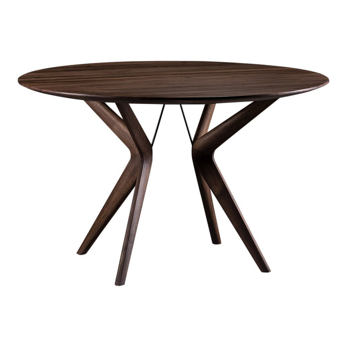 Round brown wooden dining table with sleek, angled legs and a smooth, dark wood grain pattern.