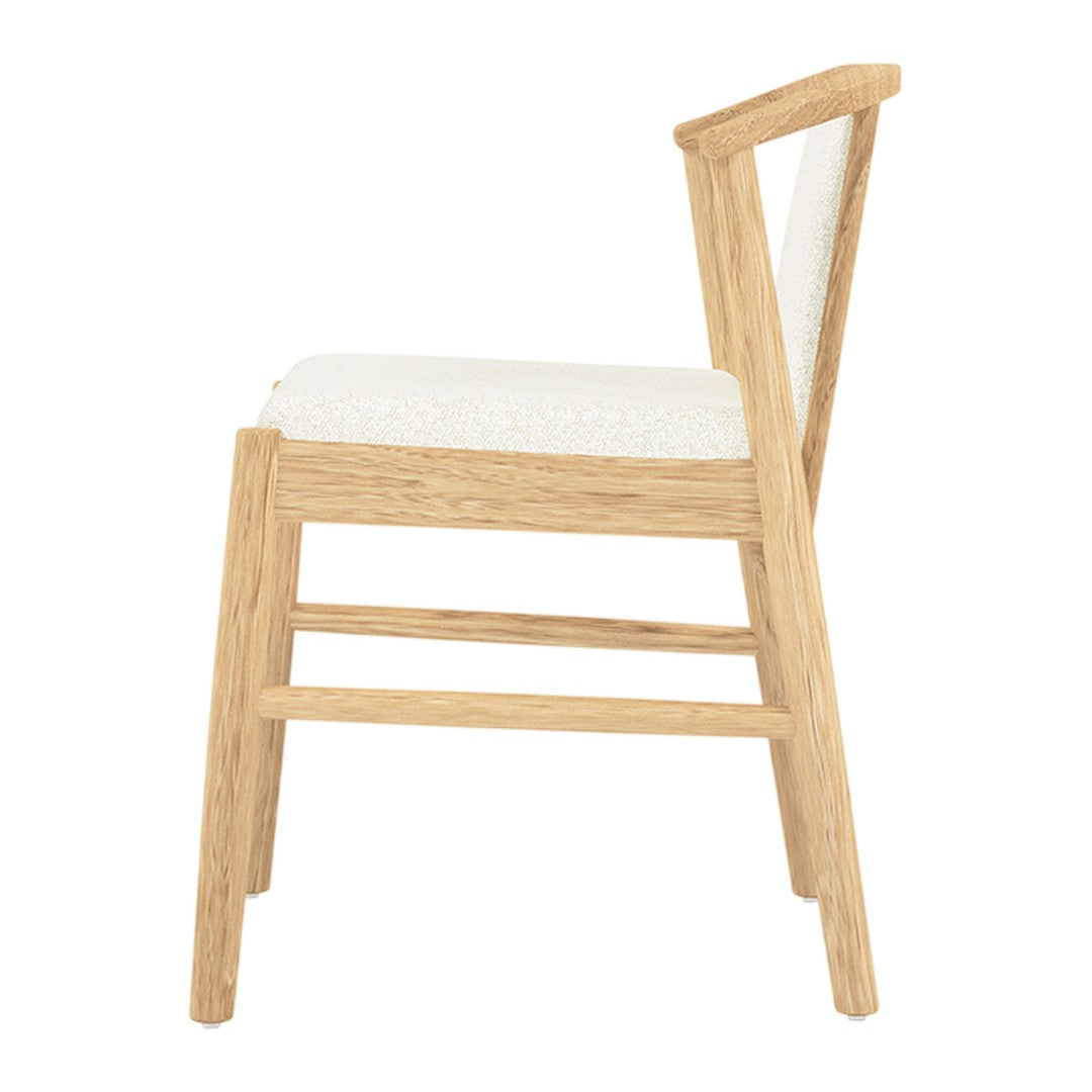 Natural oak wood chair with a cream upholstered seat and simple, minimalist design. Perfect for modern interiors.