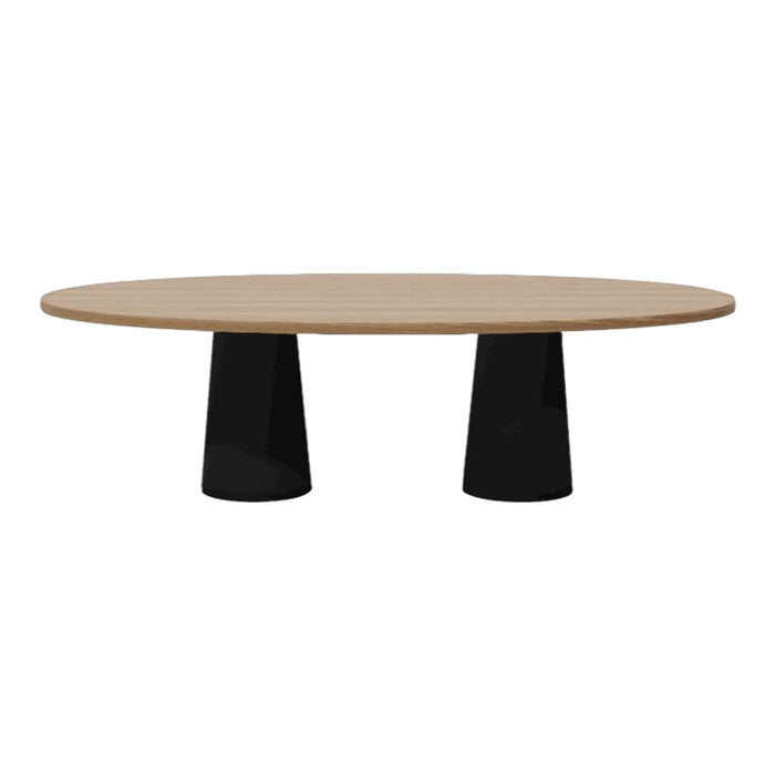 Round wooden table with a light oak top and sleek black pedestal bases. Elegant design with a modern color contrast.