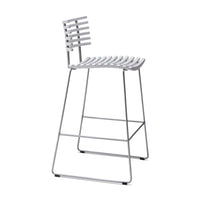 White metal bar stool with striped seat and backrest design, featuring a sleek, modern frame.