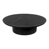 Round black marble coffee table with subtle white veining, sleek and modern design.