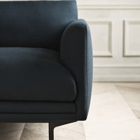 Dark navy blue fabric sofa with smooth, rounded edges and sleek black legs, showcasing a modern minimalist design.
