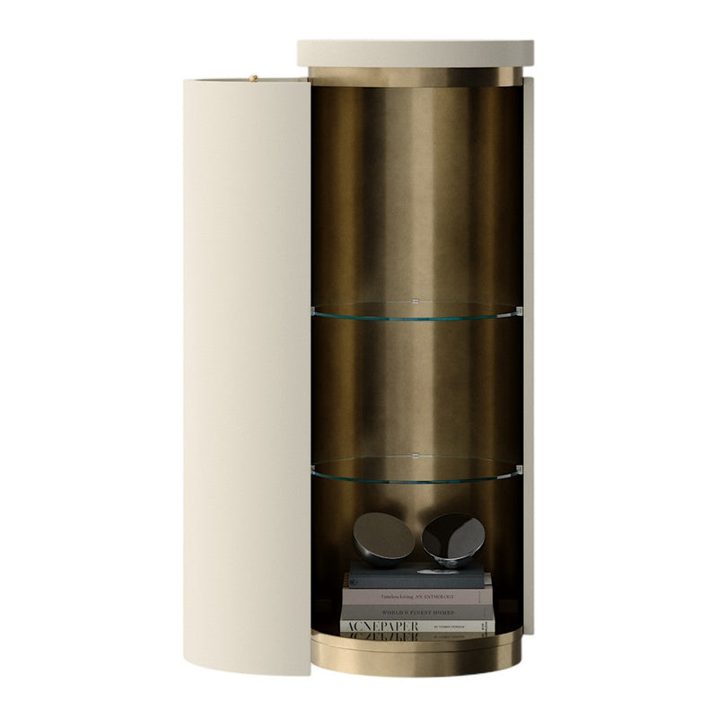 Modern cylindrical cabinet in cream and bronze with smooth finishes and glass shelves. Elegant and contemporary design.