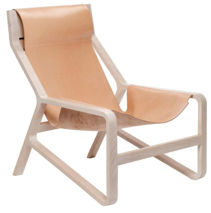 Light tan leather lounge chair with a minimalist natural wood frame, featuring simple lines and a modern design.