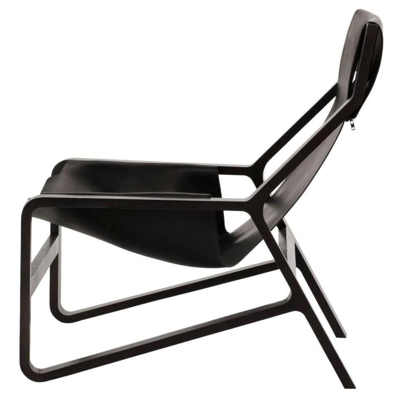 "Modern black lounge chair with sleek, minimalistic design and smooth contours."