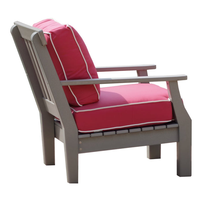 Gray outdoor chair with vibrant pink cushions and white trim, perfect for adding a pop of color to your patio.