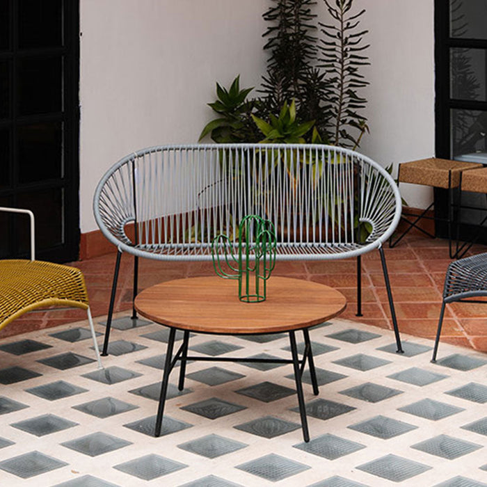 Stylish outdoor seating set featuring gray, yellow, and blue accents on a geometric patterned tiled floor.
