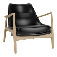Black leather armchair with light wood frame, featuring a sleek, minimalist design. Perfect for modern decor.