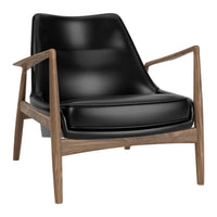 Black leather armchair with natural wood frame, featuring a sleek, modern design and minimalist aesthetic.