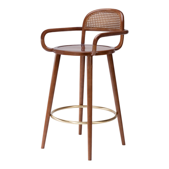 Brown wooden bar stool with a woven rattan seat and gold accent footrest, featuring a modern, minimalist design.