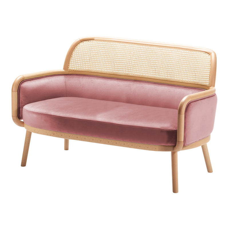 Pink velvet loveseat with a natural rattan back and light wood frame, perfect for stylish, modern decor.