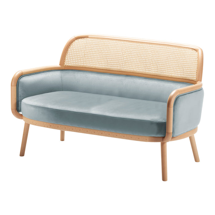 Light blue velvet two-seater sofa with natural wood and rattan accents, featuring smooth curves and modern design.