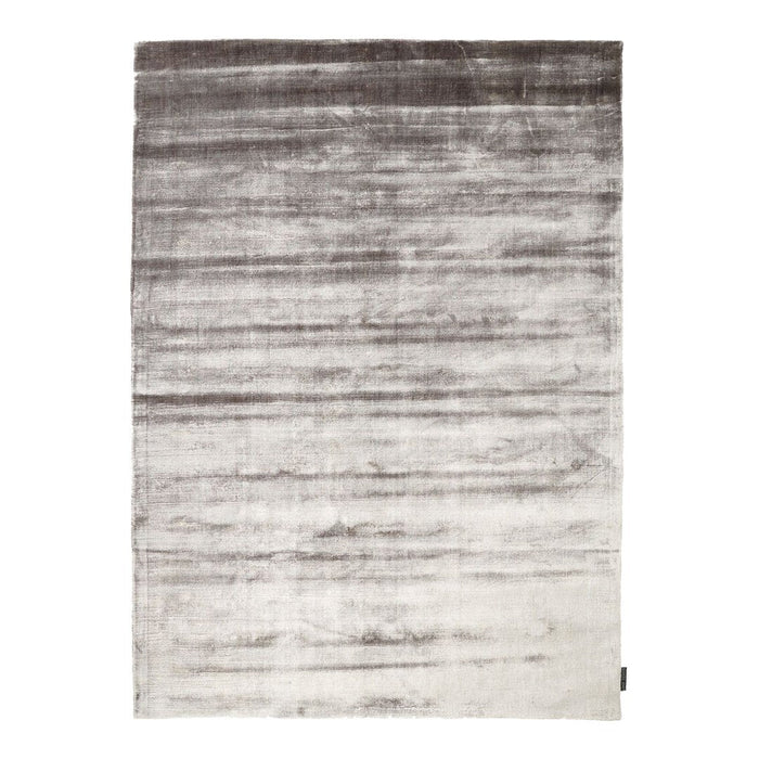 Gray to white gradient area rug with a subtle sheen and textured pattern, perfect for modern decor.