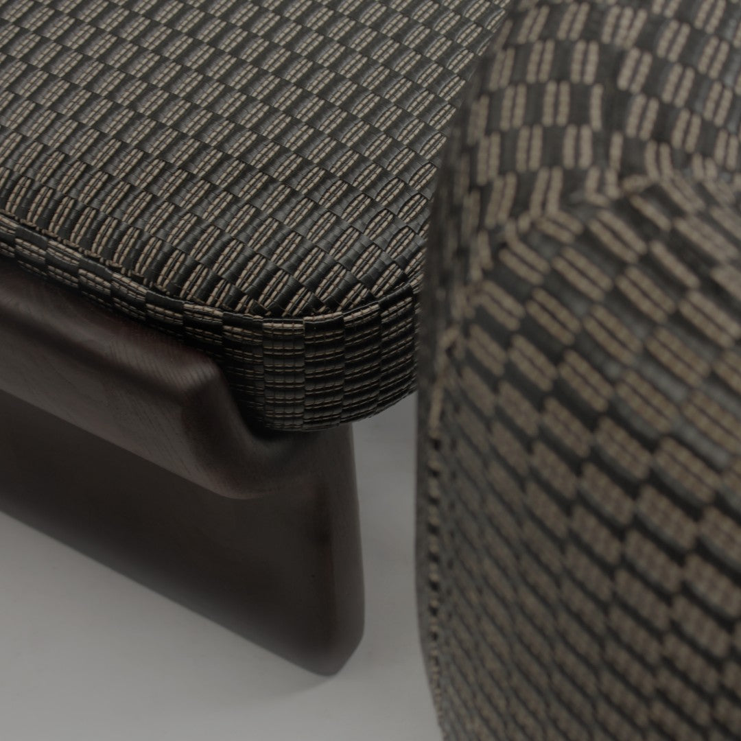 Textured black and gray patterned upholstery with a sophisticated woven design.