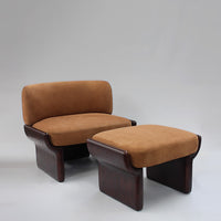 Brown upholstered armchair and ottoman with smooth wood bases, featuring a minimalist design and soft textures.